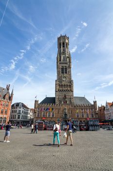 Bruges, Belgium - May 11, 2015: Tourist on Grote Markt square in Bruges
