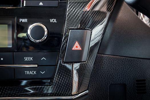 car emergency light button in interior details modern car