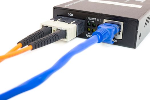 Close up fiber media converter and cables on white isolated background