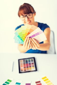 woman showing pantone color samples