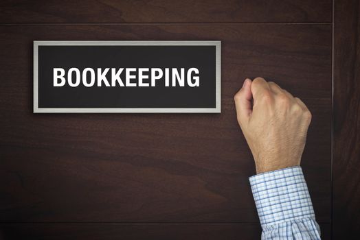 Businessman knocking on Bookkeeping office door