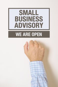 Businessman knocking on Small business advisory door