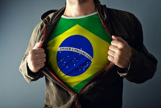 Man stretching jacket to reveal shirt with Brazil flag