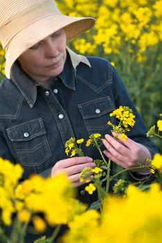 Female Farmer in Oilseed Rapeseed Cultivated Agricultural Field