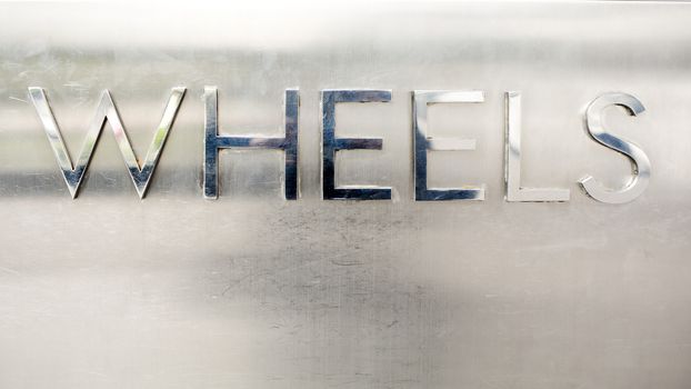 the word wheels with metal materiall - 3d illustration