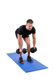 Young man shows starting position of Standing Bent Over Dumbbell Reverse Fly workout, isolated on white
