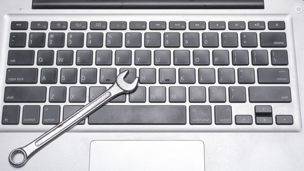wrench on laptop