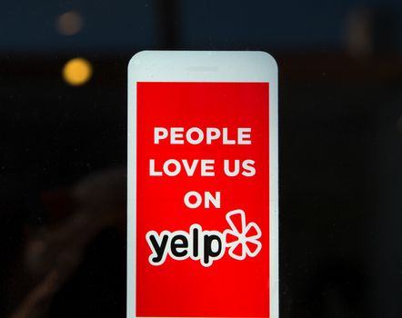 Yelp Emblem and Logo on Business Exterior