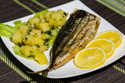 Grilled mackerel with potato salad and lemon