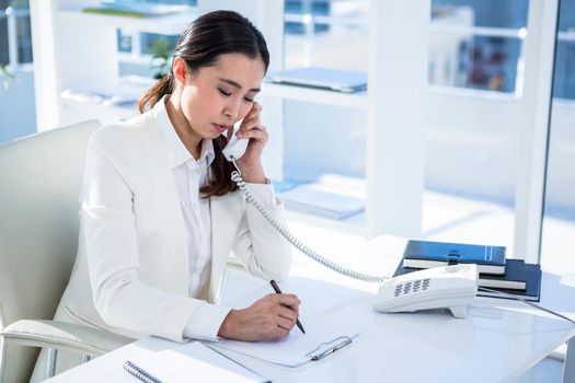 Focused businesswoman on her telephone