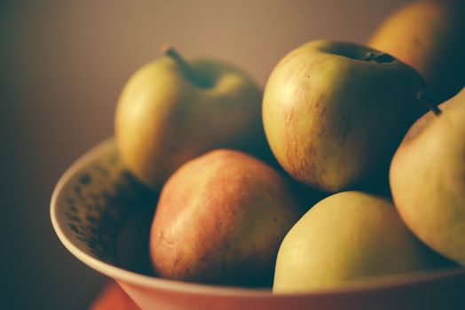 Apples in a bowl, retro toned