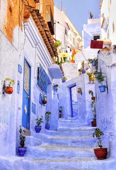 Street with stairs in medina of moroccan blue town Chaouen