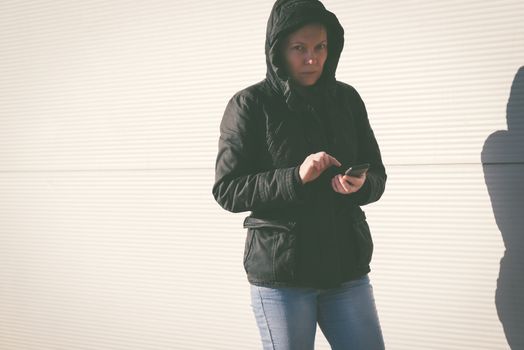 Woman texting SMS message on mobile phone