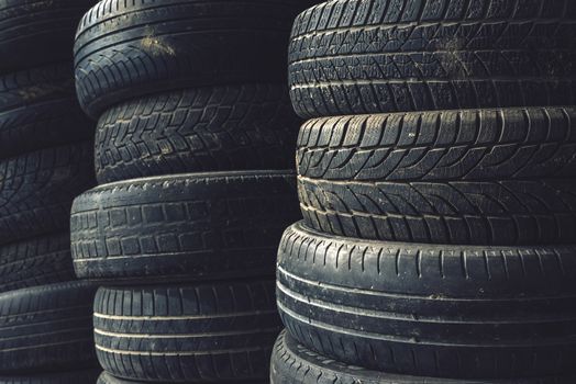 Column stack of old used car tires