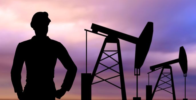 black silhouette of oil worker and pump jack