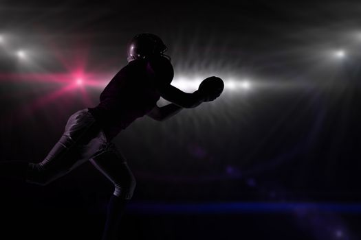 Composite image of silhouette american football player catching ball