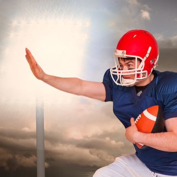 Composite image of american football player jumping with the ball