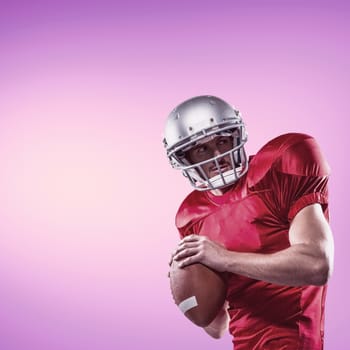 Composite image of american football player in red jersey looking away while holding ball