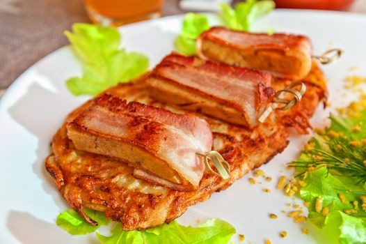 veal meat with bacon