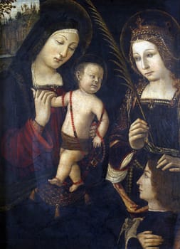 Follower of Bernardin Pinturicchi: Madonna and Child, St. Catherine and the donor
