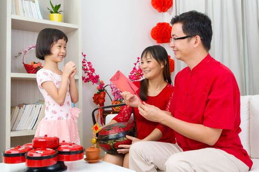 Chinese girl wishing his parent a happy chinese new year
