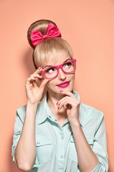 Beauty fashion nerdy woman thinking, glasses.Pinup