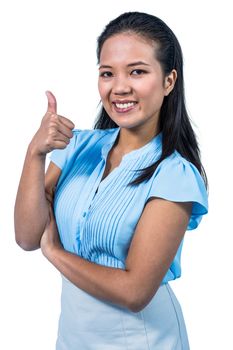 Smiling businesswoman with thumbs up 