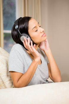 Peaceful brunette with headphones