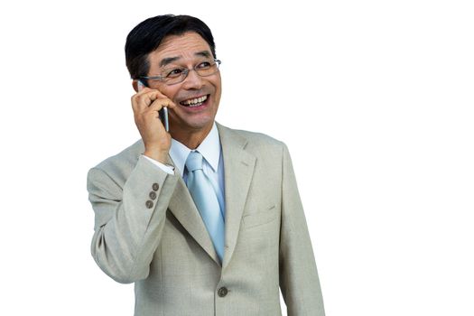 Smiling asian businessman phone calling on white background