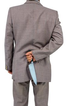 Businessman holding knife behind his back