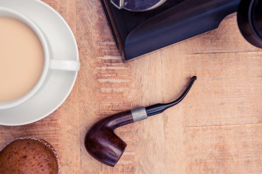 Close-up of coffee and smoking pipe