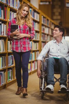 Student in wheelchair talking with classmate