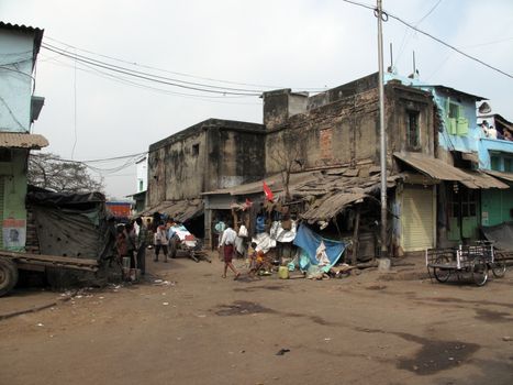 Streets of Kolkata. Poor Indian family living in a makeshift shack by the side of the road