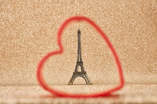 Valentines Day. Love. Red heart, Eiffel Tower, souvenir from Paris. Vintage retro  romantic style. Unusual creative art greeting card, gold background, copyspace