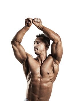 A male fit athlete posing his ripped body