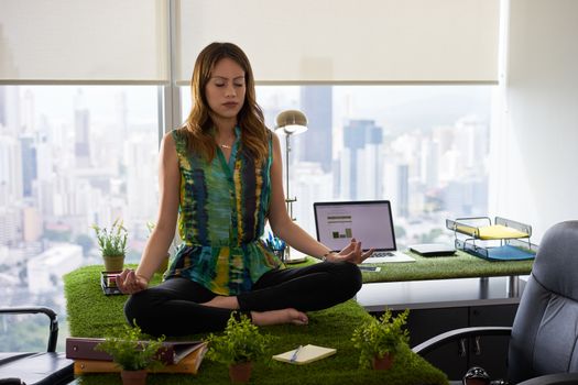 Business Woman Doing Yoga Meditation On Table In Office-2