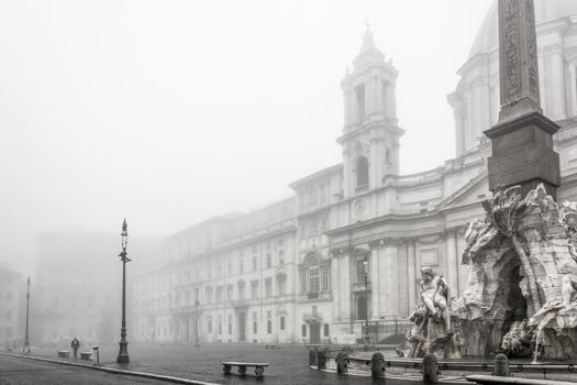 Fountain of the Four Rivers in piazza Navona wrapped in fog