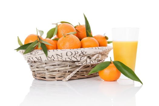 Mandarines in white wooden basket isolated on white background. Fresh ripe fruit background.