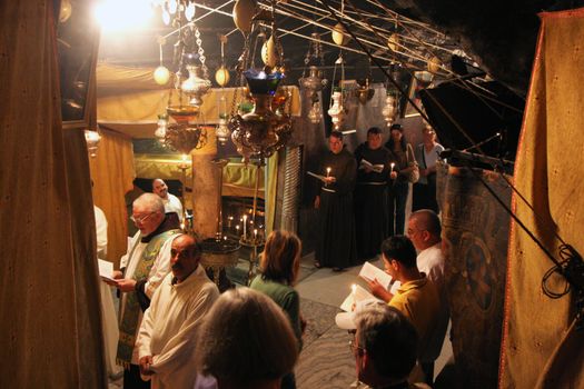 Procession from the church of St. Catherine and go to the cave in the Basilica of the Birth of Jesus, Bethlehem, Israel
