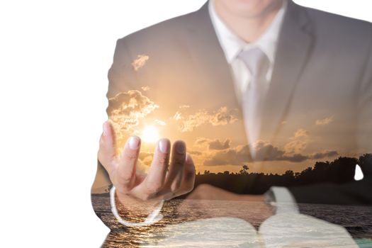 Double exposure of Business man hand hold the sunrise on the beach in the morning as Power Concept.