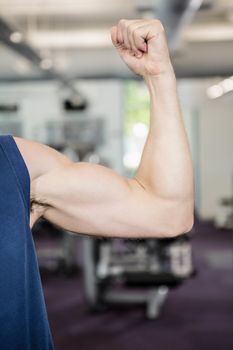 Close up of man showing biceps