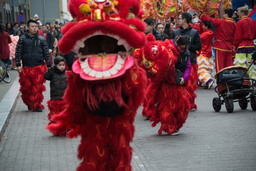 NETHERLANDS, The Hague: A dragon float parades through The Hague on February 13, 2016, for Chinese New Year celebrations. 