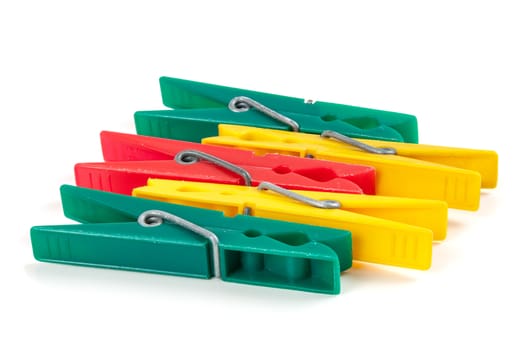 Five colorful plastic clothespins