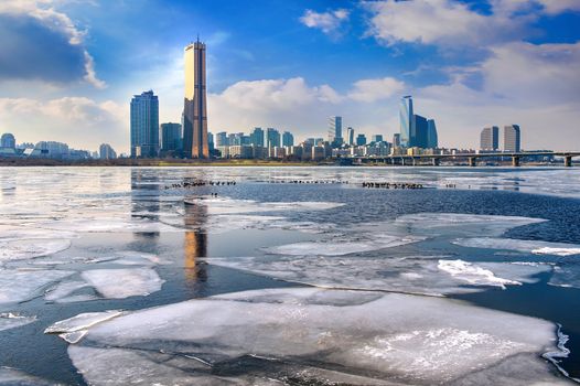 Ice of Han river and cityscape in winter,Seoul in South Korea.