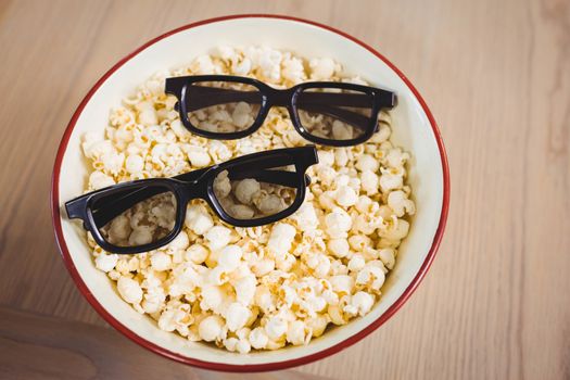 3D glasses in bowl of popcorn
