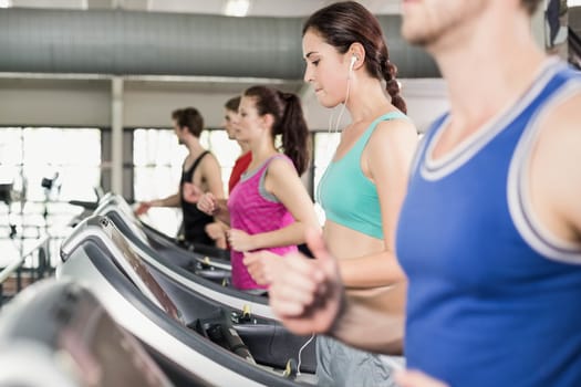 Women and men running on a treadmill