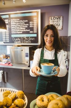 Waitress serving a cup of coffee
