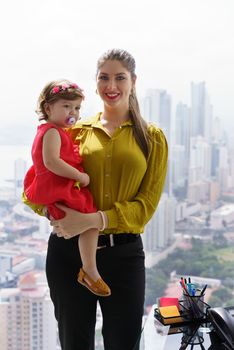 Portrait Manager Mother With Little Daughter In Office
