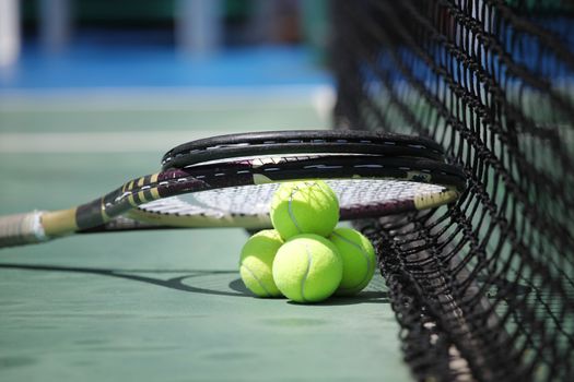 Tennis balls and racket 