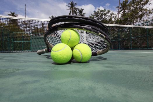 Tennis balls and racket 